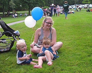 Neighbors | Jessica Harker.Tiffany Hall sat with her two younger siblings, Zachary and Alexis Roberts, at the Boardman fireworks event on July 2.
