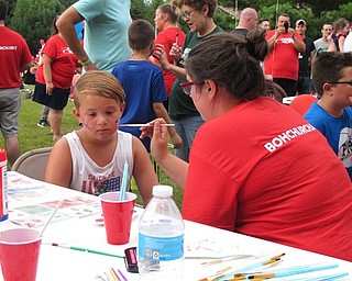 Neighbors | Jessica Harker.Jimmy Hunt got his face painted by a Bridge of Hope volunteer on July 2 during the Boardman Park's fireworks event.