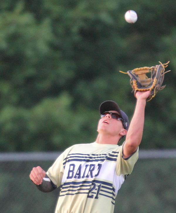 William D. Lewis The Vindicator  Baird's Jacob McCaskey(21) catches a fly ball during 1rst inning of 7-19-18 game with Troy at Cene.