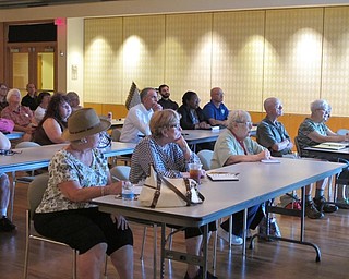 Neighbors | Jessica Harker.A crowd gathered to listen to Jim Chatfield lecture about urban trees at Fellows Riverside Garden.