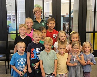 Neighbors | Abby Slanker.Peg Flynn (back) of the Mahoning Valley Green Team visited the Canfield library to present Rock Out with the Green Team.