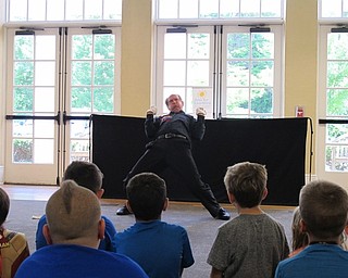 Neighbors | Jessica Harker.Reed Steele preformed as a mime for a group of children and their families gathered at the Poland library on July 10.