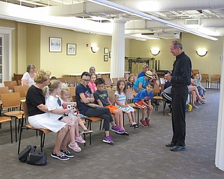 Neighbors | Jessica Harker.Reed Steele discusses what it means to be a mime and different facts about himself with children and their families at the Masks, Mimes and Imagination preformance July 10 at the Poland library.