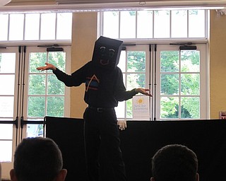 Neighbors | Jessica Harker.Reed Steele preformed part of the show with a black box covering his face on July 10 at the Poland library.