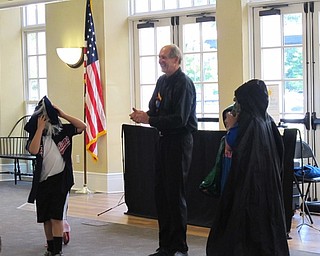Neighbors | Jessica Harker.Three children were brought up to be volunteers, a handsome prince, an evil duke and a dragon, during Reed Steeles Masks, Mimes and Imagination show July 10.