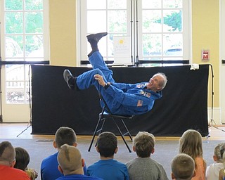 Neighbors | Jessica Harker.Reed Steele preformed a mime skit as an astronaut July 10 during the Masks, Mimes and Imagination event at the Poland library.