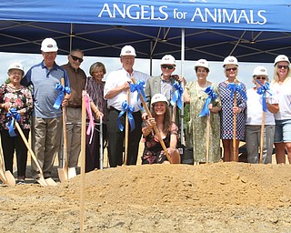 William D. Lewis The Vindicator  A ground breaking ceremony was held Sunday 7-22-18 for a new wing at Angels for Animals. Diane Less, co founder , center poses with supporters during the veremony.