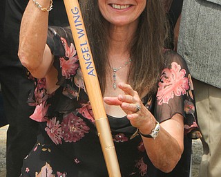 William D. Lewis The Vindicator  A ground breaking ceremony was held Sunday 7-22-18 for a new wing at Angels for Animals.Diane Less , angels co founder is shown with a shovel at the event.