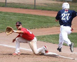 William D. Lewis The Vindicator  Baird's Connor Rakow(27) is out as Conncect's Evan Ludwick(27) makes the catch at first during7-22-18 game at Cene.