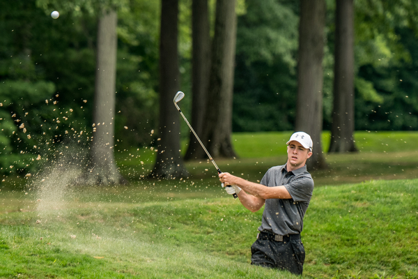 DIANNA OATRIDGE | THE VINDICATOR Seamus Chrystal from Ursuline hits a shot out of the bunker on  Hole 3 during the final round of the Greatest Golfer junior tournament at Avalon Lakes in Howland on Saturday.