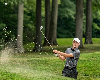 DIANNA OATRIDGE | THE VINDICATOR Seamus Chrystal from Ursuline hits a shot out of the bunker on  Hole 3 during the final round of the Greatest Golfer junior tournament at Avalon Lakes in Howland on Saturday.