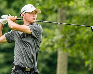 DIANNA OATRIDGE | THE VINDICATOR Seamus Chrystal from Ursuline watches his tee shot during the final round of the Greatest Golfer junior tournament at Avalon Lakes in Howland on Saturday.