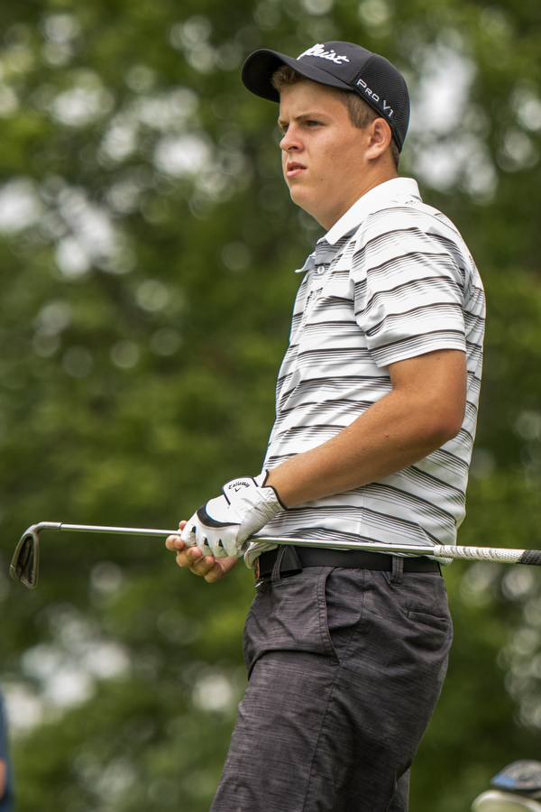 DIANNA OATRIDGE | THE VINDICATOR Howland's Joey Vitali watches his Par 3 tee shot during the final round of the Greatest Golfer junior tournament at Avalon Lakes in Howland on Saturday.