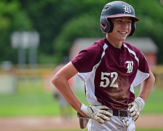 NORTH CANTON, OHIO - JULY 22, 2018: Boardman's Jack Ericson smiles while standing on third base after avoiding being caught in a rundown in the fifth inning of a Little League baseball game, Sunday night in North Canton. DAVID DERMER | THE VINDICATOR