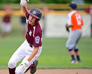 NORTH CANTON, OHIO - JULY 22, 2018: Boardman's Jack Ericson stumbles rounding second base while running to third base in the fourth inning of a Little League baseball game, Sunday night in North Canton. DAVID DERMER | THE VINDICATOR