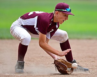 NORTH CANTON, OHIO - JULY 22, 2018: Boardman's Jack Ericson fields a ball in the fourth inning of a Little League baseball game, Sunday night in North Canton. DAVID DERMER | THE VINDICATOR