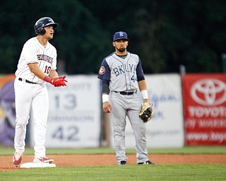 Henry Pujols cheers after getting on second during Tuesday night's game against the Cyclones.