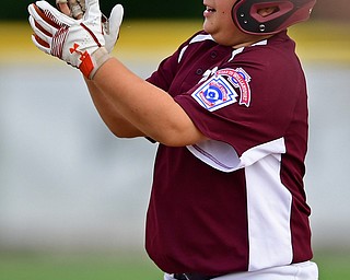 NORTH CANTON, OHIO - JULY 24, 2018: Boardman's Tyler Kirlik celebrates after hitting a two-RBI double in the first inning of a Little League baseball game, Tuesday night in North Canton. DAVID DERMER | THE VINDICATOR