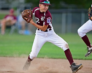 NORTH CANTON, OHIO - JULY 24, 2018: Boardman's Jack Ericson looks to second base before throwing for the force out in the third inning of a Little League baseball game, Tuesday night in North Canton. DAVID DERMER | THE VINDICATOR
