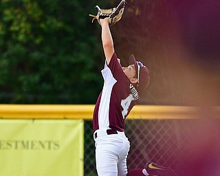 NORTH CANTON, OHIO - JULY 24, 2018: Boardman's Charlie Young jumps to catch the ball in the third inning of a Little League baseball game, Tuesday night in North Canton. DAVID DERMER | THE VINDICATOR
