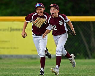 NORTH CANTON, OHIO - JULY 24, 2018: Boardman's Charlie Young, right, and Caleb Satterfield celebrate after Boardman defeated Ironton 18-0 in a League baseball game, Tuesday night in North Canton. DAVID DERMER | THE VINDICATOR
