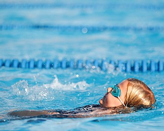 Rylynne Scriber, 6, with BTSC, competes in the 25Y Backstroke during the swim meet between Applewood Swim Club and Boardman Tennis and Swim Club at the Applewood Swim and Tennis Club on Wednesday.