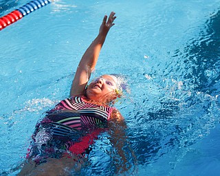 Lainey Hunt, 9, with APP, competes in the 25Y Backstroke during the swim meet between Applewood Swim Club and Boardman Tennis and Swim Club at the Applewood Swim and Tennis Club on Wednesday.
