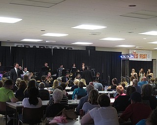 Neighbors | Zack Shively.The jazz ensemble 2 closed out their set with director Thomas Ruggieri's arrangement of "With a Little Help From My Friends," based on Joe Cocker's performance at Woodstock. Ruggieri originally arranged the piece for the marching band, but he gave it to the jazz ensemble to play as well. Pictured, the band performed the song while Patrick Kale sang with Randi Baghurst, Dani Girardi and Desi Girardi backing him up.