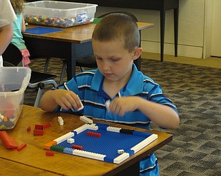 Neighbors | Jessica Harker.Nico Hans built with Legos at the June 22 Lego's at the Library event at the Austintown branch.