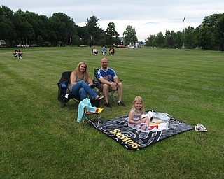 Neighbors | Jessica Harker .Christine and Mark DiGiacomo sat with their daughter, Marianna DiGiacomo, age 5, during the June 21 Boardman high school jazz badn concert at Maag theatre.