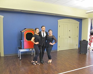 Neighbors | Natalie Wright.Magician and illusionist David Anthony posed with his assistants after the show at the Boardman library on July 16. A native of Cleveland, Anthony came to the library as part of the Summer Discovery program. He performs at various venues in the area throughout the year.