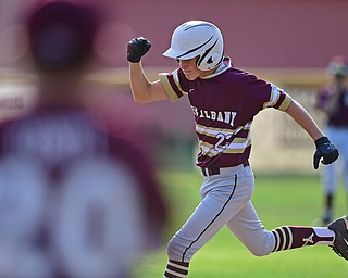 NORTH CANTON, OHIO - JULY 26, 2018: New Albany's Ben Liebel pumps his fist while running the bases after hitting a solo home run off Boardman starting pitcher Gavin Hyde in the fourth inning of a Little League baseball game, Thursday night in North Canton. New Albany won 3-1. DAVID DERMER | THE VINDICATOR