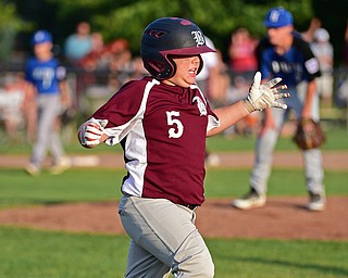 NORTH CANTON, OHIO - JULY 17, 2018: Boardman's Tyler Kirlik celebrates after hitting a walk off single with the bases loaded to beat Hamilton 5-4 in the sixth inning of a Little League baseball game, Friday night in North Canton. DAVID DERMER | THE VINDICATOR
