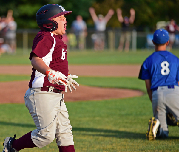 NORTH CANTON, OHIO - JULY 17, 2018: Boardman's Tyler Kirlik celebrates after hitting a walk off single with the bases loaded to beat Hamilton 5-4 in the sixth inning of a Little League baseball game, Friday night in North Canton. DAVID DERMER | THE VINDICATOR