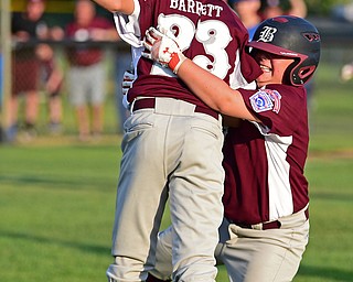 NORTH CANTON, OHIO - JULY 17, 2018: Boardman's Tyler Kirlik, right, is congratulated by XXX after hitting a walk off single with the bases loaded to beat Hamilton 5-4 in the sixth inning of a Little League baseball game, Friday night in North Canton. DAVID DERMER | THE VINDICATOR