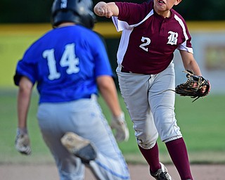 NORTH CANTON, OHIO - JULY 17, 2018: Boardman's Gavin Hyde, right, forces out Hamilton's Nick Brosivs at second base while throwing to first for a double play in the third inning of a Little League baseball game, Friday night in North Canton. Boardman won 5-4. DAVID DERMER | THE VINDICATOR