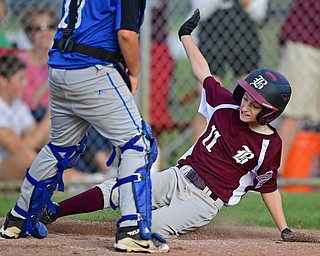 NORTH CANTON, OHIO - JULY 17, 2018: Boardman's Evan Sweder slides into home plate to score a run in the fourth inning of a Little League baseball game, Friday night in North Canton. Boardman won 5-4. DAVID DERMER | THE VINDICATOR