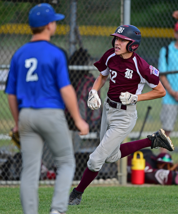NORTH CANTON, OHIO - JULY 17, 2018: Boardman's Jack Ericson comes home to score after hitting a inside the park home run off Hamilton starting pitcher Jonathan Alcorn in the fifth inning of a Little League baseball game, Friday night in North Canton. Boardman won 5-4. DAVID DERMER | THE VINDICATOR