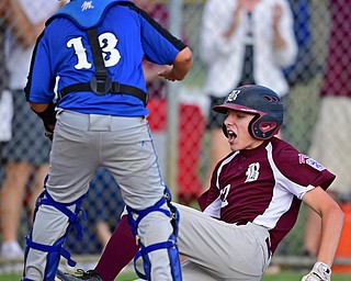 NORTH CANTON, OHIO - JULY 17, 2018: Boardman's Jack Ericson slides into home to score after hitting a inside the park home run off Hamilton starting pitcher Jonathan Alcorn in the fifth inning of a Little League baseball game, Friday night in North Canton. Boardman won 5-4. DAVID DERMER | THE VINDICATOR