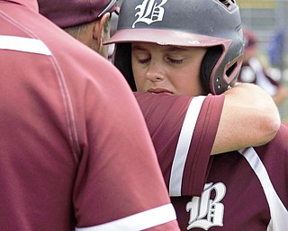 Gavin Hyde of the Boardman All-Stars is consoled by New Albany manager Greg Ecleberry during the medal ceremony following a loss in the Little League state championship game at North Canton Recreational Complex on Saturday afternoon.