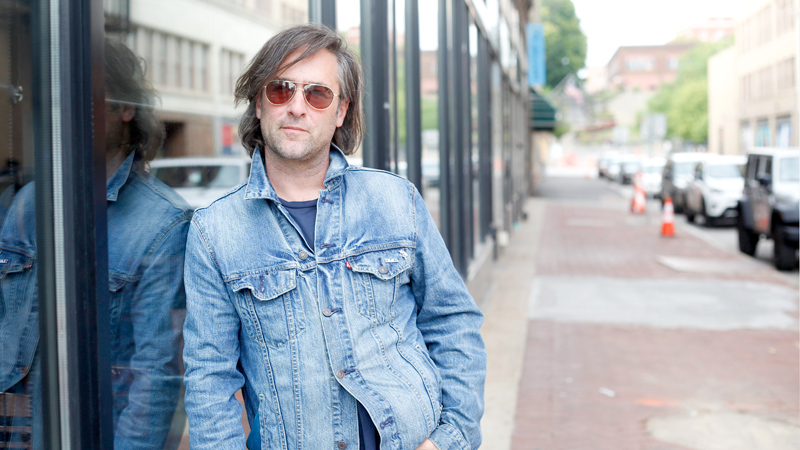 Ken Goldstein stands outside V2 Wine Bar and Trattoria in downtown Youngstown. He visited the area Monday. Goldstein's documentary "Song of Bethlehem," produced by PBS, will be available soon.