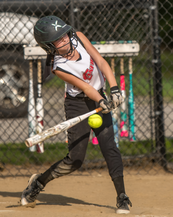 DIANNA OATRIDGE | THE VINDICATOR Canfield's Marina Koenig makes contact during 10U state tournament action against Austintown in Tallmadge on Monday. Canfield won 18-4 to advance to the championship.