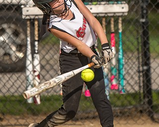 DIANNA OATRIDGE | THE VINDICATOR Canfield's Marina Koenig makes contact during 10U state tournament action against Austintown in Tallmadge on Monday. Canfield won 18-4 to advance to the championship.