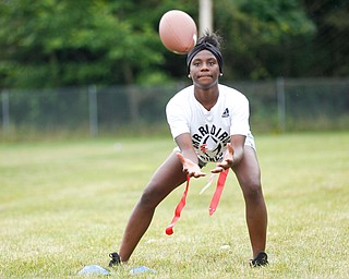 Iazia Wyan, 15, of Youngstown, gets ready to catch the ball at the Grrridiron Girls Flag Football Camp at Glacier Field in Struthers on Tuesday. EMILY MATTHEWS | THE VINDICATOR