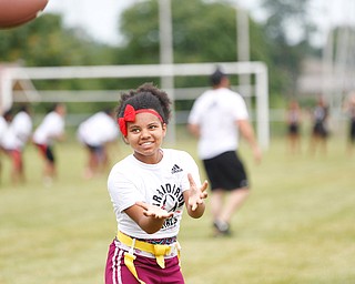 Laionia Williams, 13, of Youngstown, gets ready to catch the ball at the Grrridiron Girls Flag Football Camp at Glacier Field in Struthers on Tuesday. EMILY MATTHEWS | THE VINDICATOR