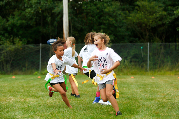 Girls participate in the Grrridiron Girls Flag Football Camp at Glacier Field in Struthers on Tuesday. EMILY MATTHEWS | THE VINDICATOR