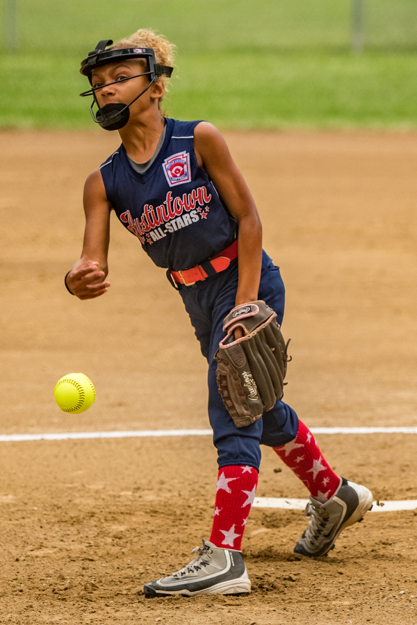 DIANNA OATRIDGE | THE VINDICATOR Austintown's Kali Ray fires a pitch during their 7-3 loss to Tallmadge in the 9-10 Little League state tournament loser's bracket game on Wednesday at Indian Hills Field in Tallmadge.