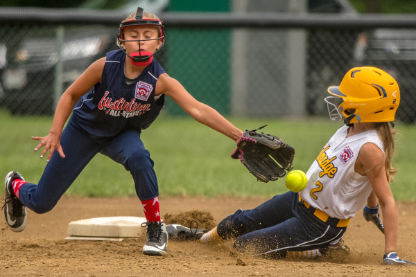 DIANNA OATRIDGE | THE VINDICATOR Austintown's Sam Severn attempts to tag Tallmadge's Danielle Sharton during their 9-10 Little League state tournament loser's bracket game on Wednesday at Indian Hills Field. Tallmadge won 7-3.