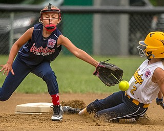 DIANNA OATRIDGE | THE VINDICATOR Austintown's Sam Severn attempts to tag Tallmadge's Danielle Sharton during their 9-10 Little League state tournament loser's bracket game on Wednesday at Indian Hills Field. Tallmadge won 7-3.