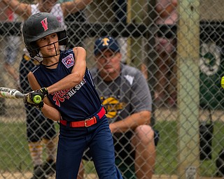 DIANNA OATRIDGE | THE VINDICATOR Austintown's Rachel Spalding keeps her eye on the ball in the batter's box during their 9-10 Little League state tournament loser's bracket game on Wednesday at Indian Hills Field. Tallmadge won 7-3.